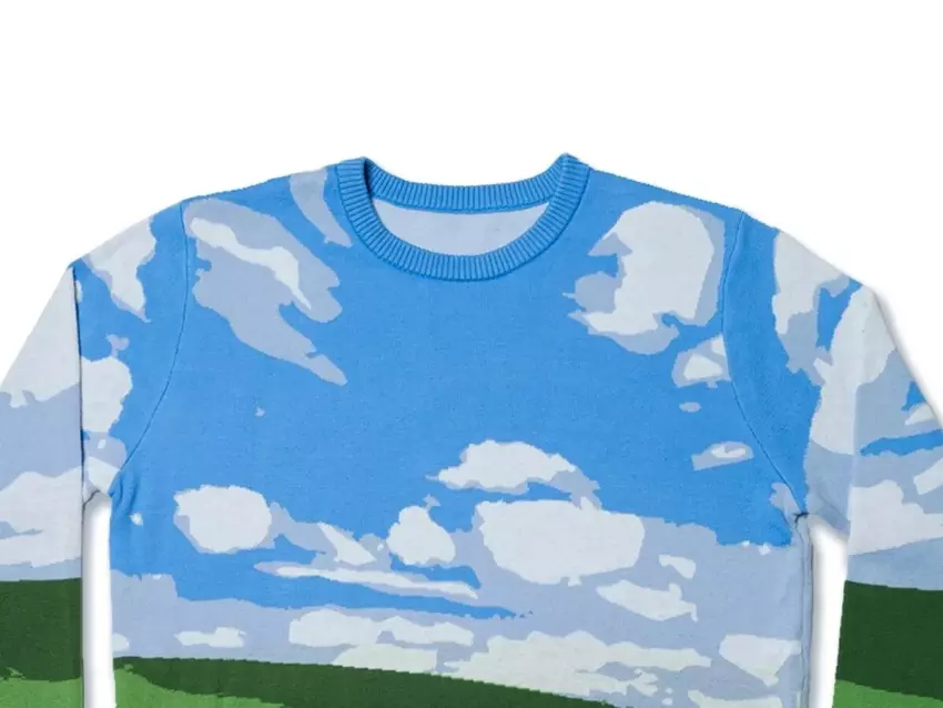 Microsoft hat einen hässlichen Weihnachtspulli im Stil des berühmten Hintergrundbildes von Windows XP veröffentlicht