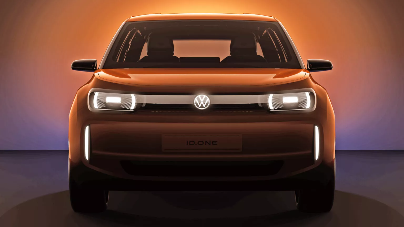 Erster Teaser des neuen Elektroautos von Volkswagen mit dem Schriftzug "ID.One" anstelle des Nummernschilds.